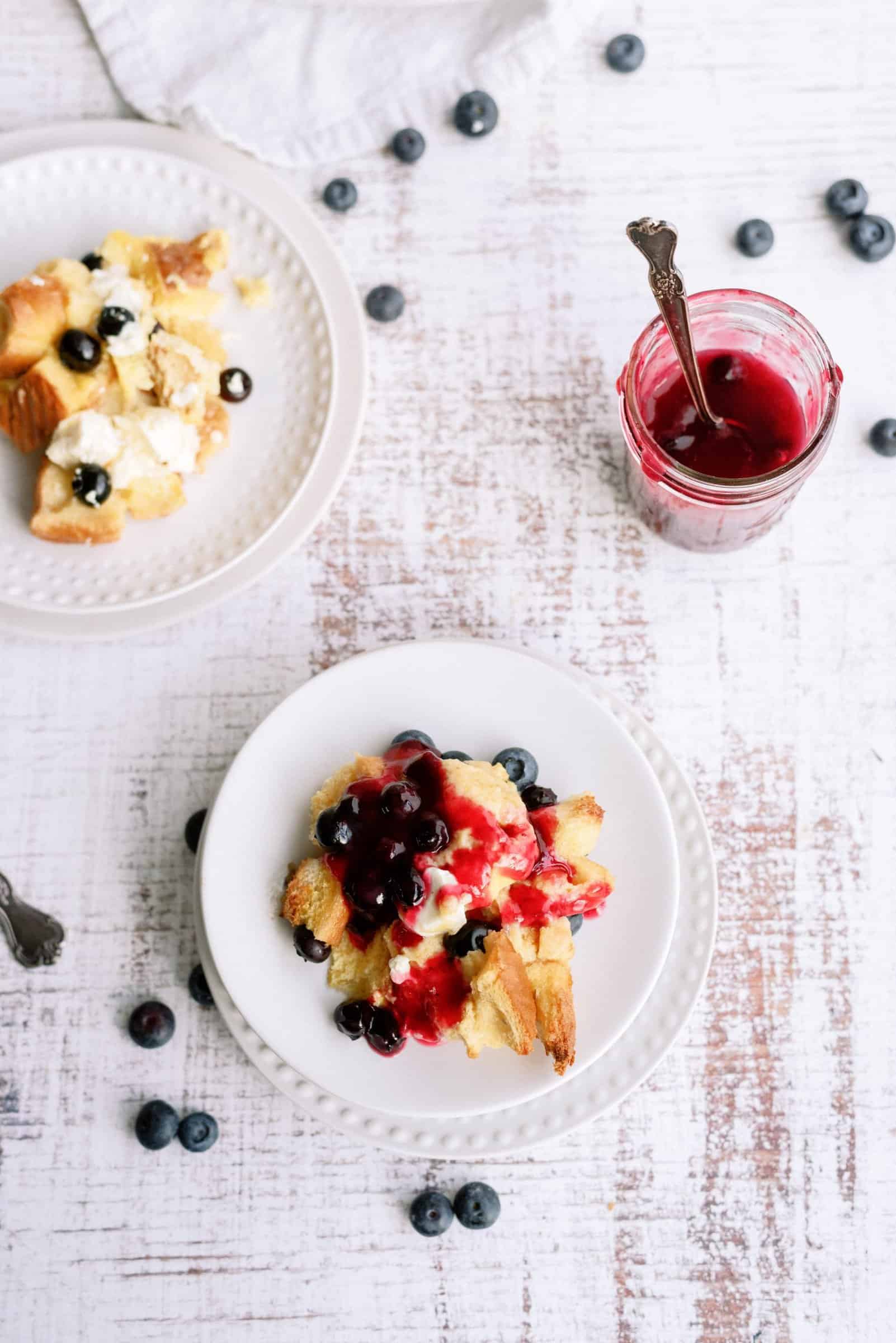 Top view of Overnight Blueberry French Toast on a plate with fresh blueberries.