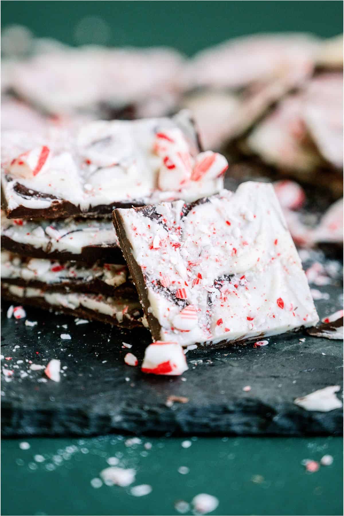 Pieces of Peppermint Bark stacked with one leaning against the stack.