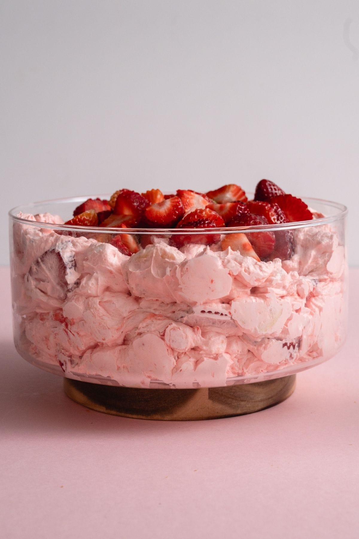 Side view of a bowl of Strawberry Jello Fluff Salad.